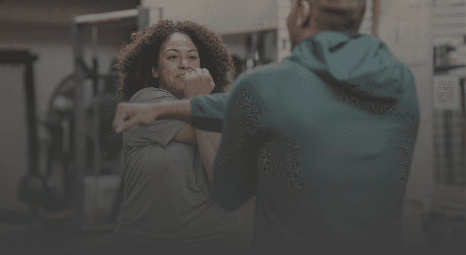 Client working one-on-one with a certified personal trainer at Health Targeted Solutions in Clinton Township, MI